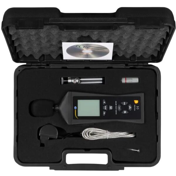 A hard plastic carrying case containing a digital sound level meter with accessories. The case has a foam lining. Visible items include the sound level meter, a windscreen foam cover, a USB cable, a metal adapter, a battery, and a CD-ROM.